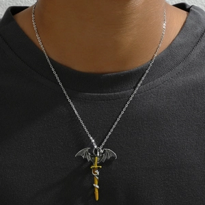 Close-up of a silver dragon pendant wrapped around a gold sword on a steel chain
