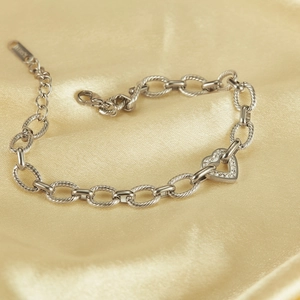 Silver steel bracelet with chunky chain links and heart pendant inlaid with zircons
