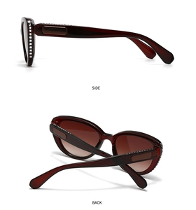 Detail view of burgundy cat eye sunglasses featuring rhinestones and metal accents