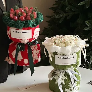 Christmas bouquet with red and green snowflake knit fabric wraps and festive decor