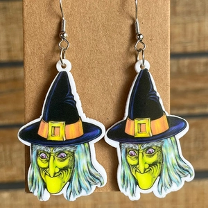 Halloween acrylic witch earrings with metal hooks on display card, cartoon holiday style
