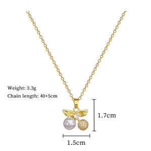 Detail view of gold cherry necklace with pearls and zircons showing precise dimensions