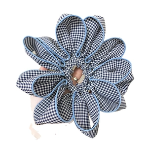 Navy blue gingham plaid floral scrunchie with layered fabric petals for ponytails