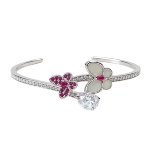 Vintage silver open bangle featuring zircon butterfly charms and a teardrop diamond drop