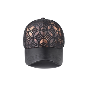 Close-up of patterned crown and matte leather brim of this stylish plaid baseball cap
