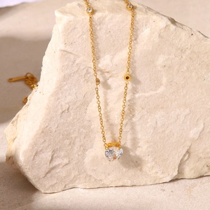 18K gold-plated stainless steel necklace with heart-shaped zircon pendant on white rock