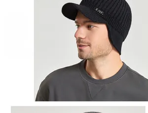 Detail view of winter knitted cap with ear protection and metal JEANS emblem logo