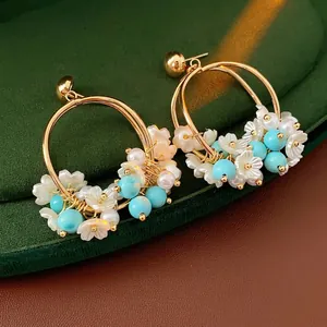 Vintage floral pearl earrings with gold metal hoops and sky blue beads for beach vacation