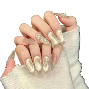 Cat eye handmade press-on nails with champagne gold finish and elegant pearl floral accents