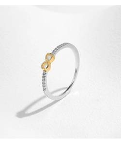 Close-up of infinity symbol ring with embedded cubic zirconia on a minimalist silver band