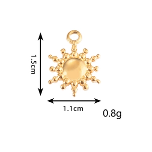 Detailed view of sun pendant dimensions 1.5cm by 1.1cm in gold stainless steel