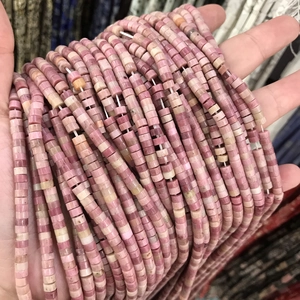 Macro shot of 2x4mm pink cylindrical natural stone beads for DIY jewelry making