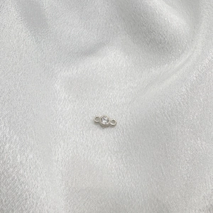 Macro detail of S925 sterling silver connector with clear zircon for DIY jewelry making