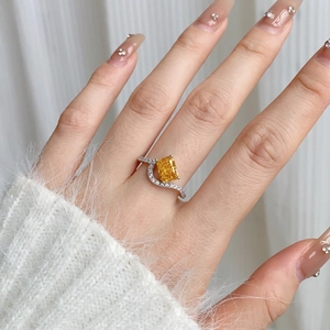 Detailed macro view of S925 silver ring featuring rectangular yellow zircon and wave band