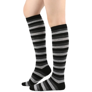 Detail shot of black and grey striped knee high socks made from soft cotton blend fabric