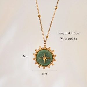 Detail view of gold octagonal star pendant necklace with dimensions and green natural stone