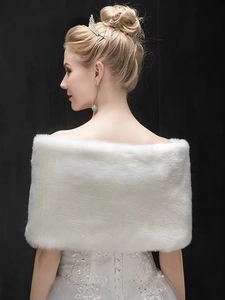 Rear view of soft white faux fur bridal shawl showing plush texture for wedding dresses