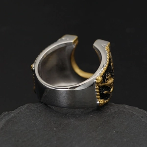 Horseshoe and cowboy boot ring in two-tone stainless steel with embossed gold detailing