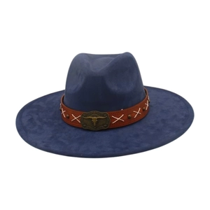 Detailed view of a navy blue ethnic style wide-brimmed hat with bull skull buckle decoration