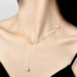 Minimalist Y-shaped golden wheat spike necklace with elegant white pearl accents