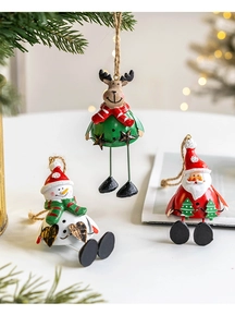Detailed view of three resin Christmas ornaments featuring Santa, Snowman and Reindeer