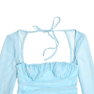 Detail of light blue mesh dress featuring ruched corset waist and sheer long sleeves