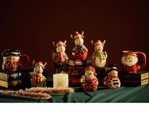 Detailed view of Christmas ceramic reindeer and Santa mugs in a cozy festive scene