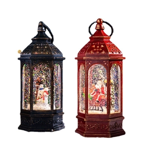 Lighted musical Christmas lantern with Santa and snowman designs for holiday decor