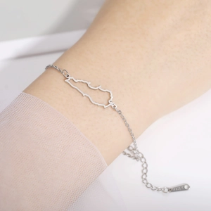 Silver stainless steel bracelet with Lebanon map hollow cut-out pendant on female wrist