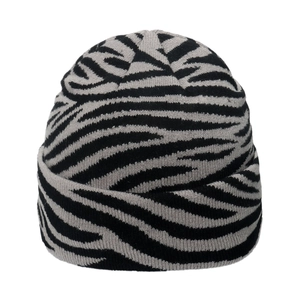 Winter knitted beanie featuring a black and gray zebra stripe pattern for stylish warmth
