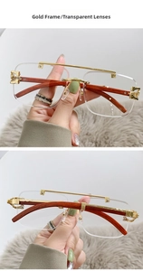 Detail of gold metal bridge and dark brown wood grain temples on square pilot glasses