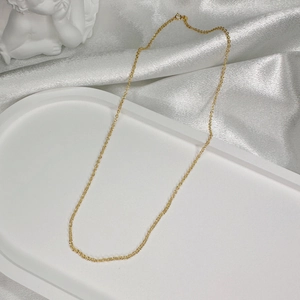 Elegant gold-plated S925 silver O-chain necklace on a white silk display stand