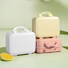 Detailed close-up of 14-inch mini hardshell vanity cases in white, yellow, and pink colors