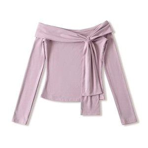 Close-up of lilac off-shoulder top featuring a unique front knot detail and knit texture
