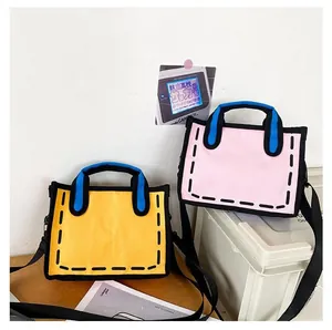 Detail of 2D cartoon style canvas tote bags in yellow and pink with bold black outlines