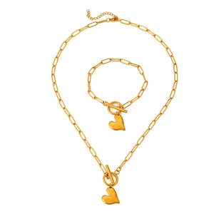 Detailed view of 18k gold plated stainless steel heart necklace and bracelet with OT clasp