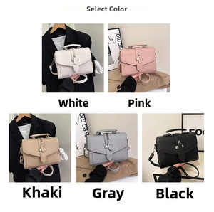 Detail view of stylish leather handbags in five colors with metal locks and top handles