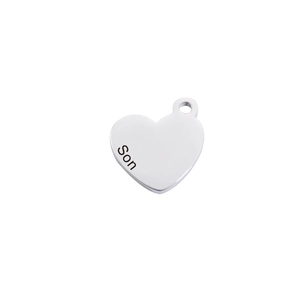 Macro shot of silver mirror-finish heart pendant with Son laser engraving detail