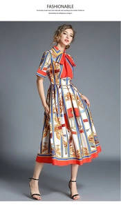 Detail of vintage midi dress featuring colorful stripes and a prominent red bow neckline
