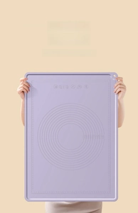 Extra large purple silicone baking mat with measurement markings and heat resistance info