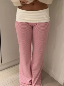 Detailed view of pink and white striped trousers with a white elastic waistband