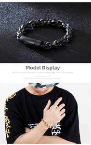 Detail view of matte black and gold stainless steel chain bracelets for men