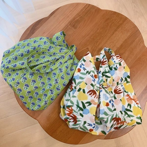 Floral print cotton tote bags in green and white with minimalist crossbody shoulder straps