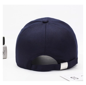 Detail of navy blue cotton baseball cap back with adjustable silver metal buckle strap