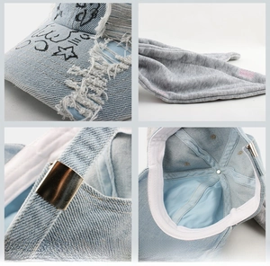 Detailansicht der Distressed-Denim-Textur mit Graffiti und verstellbarer Metallschnalle