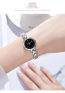 Close-up of elegant women's quartz watch with silver chain strap and black dial