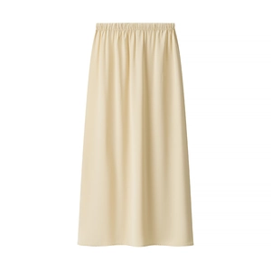Detail view of beige satin long skirt with elastic waistband and silky texture