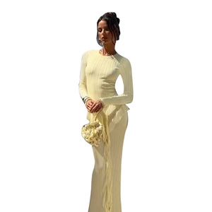 Pale yellow slim-fit ribbed knit long sleeve maxi dress with ruffled hem and round neck