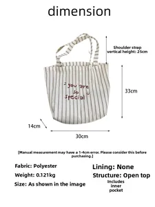 Detailed dimension guide for striped canvas tote bag with embroidered quote and smiley face