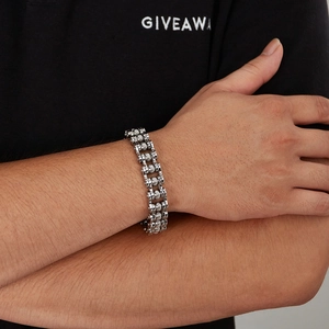 Detail of silver stainless steel punk chain bracelet with industrial textured beads